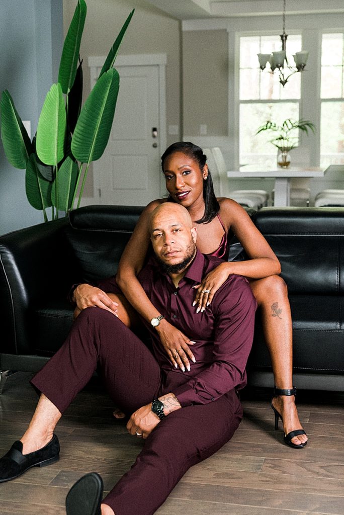 Editorial photo of black couple relaxing in their living room