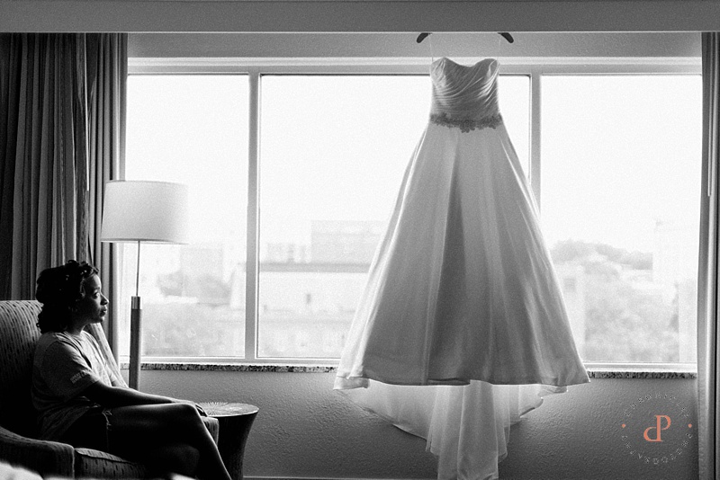 Bride looking at wedding dress. Wedding dress photography