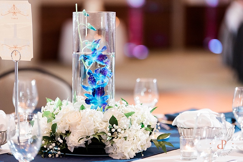 Wedding table orchid centerpieces. Surf City Florist