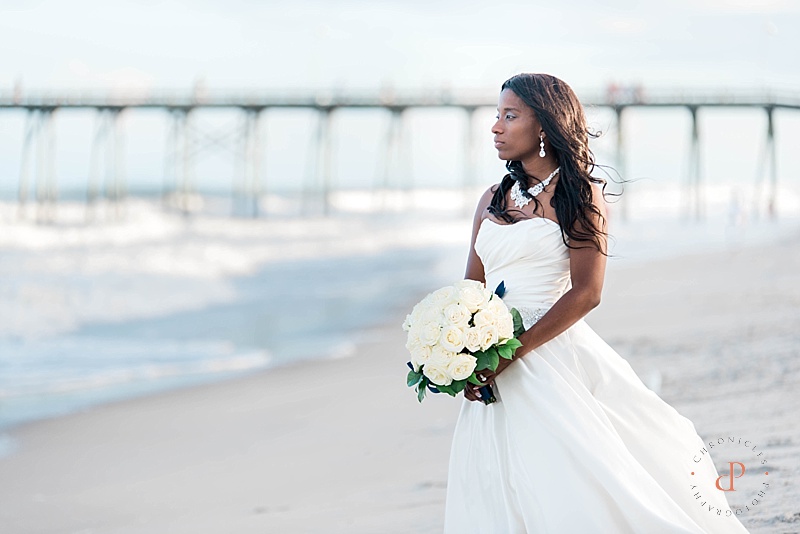 Kure Beach Wedding. Bride on the beach holding bouquet