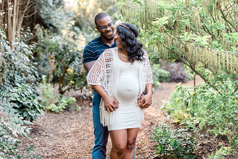 African American maternity photo in the woods
