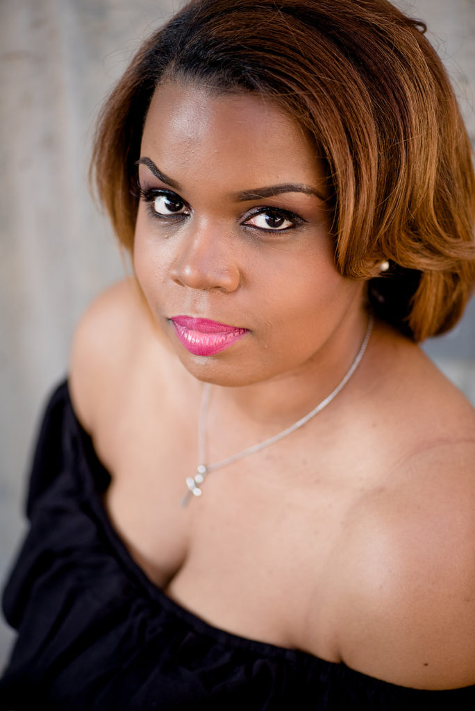 Headshot of black woman - Photographer Kafi Pettiford of Lady Iman Photography. 