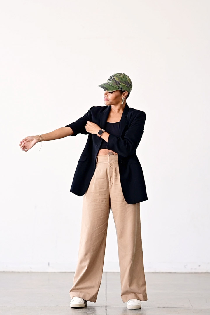 Neutral Style clothing, tan slacks and black blazer, and hat. Brand Photoshoot ideas. Michelle Dawn Photography. Maximize Your Wardrobe For Your Brand Shoot